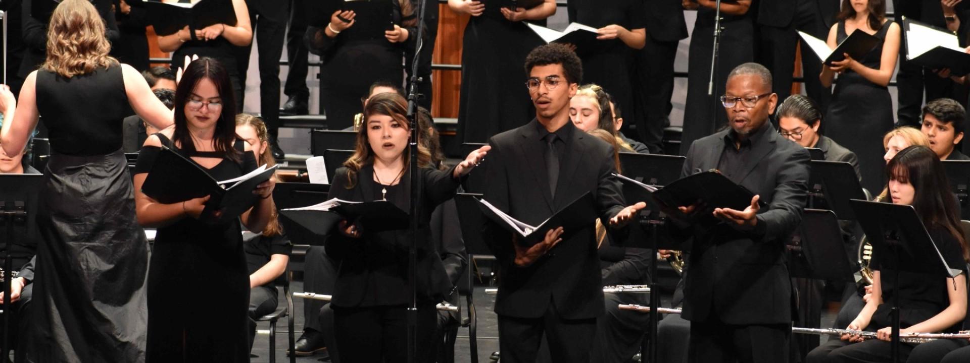 The University Choir and Wind Ensemble conducted by Dr. Emily Moss at the Luckman